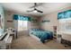 Cozy ' bedroom with a colorful theme, desk, and comfortable bed at 20926 E Longwood Dr, Queen Creek, AZ 85142