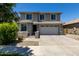 Beautiful two-story home with a well-manicured front yard and a two-car garage at 20926 E Longwood Dr, Queen Creek, AZ 85142