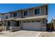 Exterior view of a two-story home featuring a two-car garage at 20926 E Longwood Dr, Queen Creek, AZ 85142