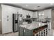 Modern kitchen with a large island, stainless steel appliances, and ample counter space at 20926 E Longwood Dr, Queen Creek, AZ 85142