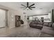 Open-concept living space with modern decor seamlessly connecting the living room and kitchen at 20926 E Longwood Dr, Queen Creek, AZ 85142