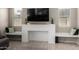 Bright living area showcases a fireplace with built-in benches, complemented by neutral décor and ample natural light at 20926 E Longwood Dr, Queen Creek, AZ 85142