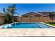 Refreshing pool with stylish travertine tile surround, perfect for summer relaxation and enjoyment at 20926 E Longwood Dr, Queen Creek, AZ 85142