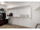 Walk-in closet with custom shelves and ample storage space for clothes and accessories at 20926 E Longwood Dr, Queen Creek, AZ 85142