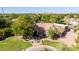 Aerial view of a home featuring mature landscaping and a circular driveway with a fountain at 2558 E Page Ct, Gilbert, AZ 85234