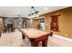 Finished basement includes pool table, bar and stonework fireplace, offering entertainment at 2558 E Page Ct, Gilbert, AZ 85234