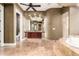 Luxurious bathroom boasting dual sinks, a makeup vanity, a soaking tub, a walk-in shower, and neutral accents at 2558 E Page Ct, Gilbert, AZ 85234