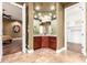 Elegant bathroom featuring marble floors, a makeup vanity, and seamless access to a walk-in closet at 2558 E Page Ct, Gilbert, AZ 85234