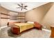 Relaxing bedroom with warm tones, floating shelves and modern furniture at 2558 E Page Ct, Gilbert, AZ 85234