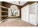 Cozy bedroom boasting built-in shelves, and a bright window offering neighborhood views at 2558 E Page Ct, Gilbert, AZ 85234