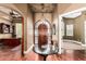 Elegant foyer featuring wood floors, a decorative glass door, and views of the office at 2558 E Page Ct, Gilbert, AZ 85234