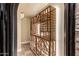 Wine storage rack in a hallway illuminated with modern recessed lighting at 2558 E Page Ct, Gilbert, AZ 85234