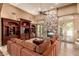 Inviting living room boasts a stone fireplace and large built-ins for ample storage at 2558 E Page Ct, Gilbert, AZ 85234