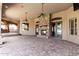 The outdoor patio features a stone fireplace and multiple ceiling fans at 2558 E Page Ct, Gilbert, AZ 85234