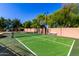 Outdoor sport court with tennis and basketball, set against a backdrop of lush greenery at 2558 E Page Ct, Gilbert, AZ 85234