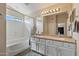 The primary bathroom has a wide mirror with a vanity that has double sinks at 25818 N 68Th Ave, Peoria, AZ 85383