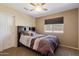 This bedroom has neutral walls, a window, and neutral wall-to-wall carpeting at 25818 N 68Th Ave, Peoria, AZ 85383