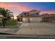 This beautiful two-story home features a spacious three-car garage at 25818 N 68Th Ave, Peoria, AZ 85383