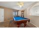 Spacious game room featuring a pool table and ample space for entertainment at 25818 N 68Th Ave, Peoria, AZ 85383