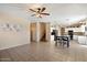 Open floor plan showing the kitchen, living room, dining area and access to the stairs at 25818 N 68Th Ave, Peoria, AZ 85383