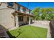 Covered backyard patio with artificial turf and ample seating space at 263 N Wilson Dr, Chandler, AZ 85225