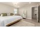 Bright bedroom with wood-look floors, large windows and a modern chandelier at 263 N Wilson Dr, Chandler, AZ 85225