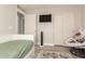 Functional bedroom with plank floors, ample lighting, and a wall-mounted television at 263 N Wilson Dr, Chandler, AZ 85225