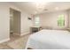 Bright bedroom with wood-look floors, large windows and an ensuite bathroom at 263 N Wilson Dr, Chandler, AZ 85225