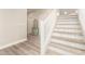Entryway featuring light wood-look floors, stairs, and doors with silver hardware at 263 N Wilson Dr, Chandler, AZ 85225