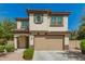 Charming two-story home featuring a desert landscape, shuttered window, and a two-car garage at 263 N Wilson Dr, Chandler, AZ 85225