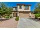 Charming two-story home with a well-manicured front yard and a two-car garage at 263 N Wilson Dr, Chandler, AZ 85225