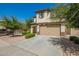 Two-story home with a two-car garage, desert landscaping and a paved driveway at 263 N Wilson Dr, Chandler, AZ 85225