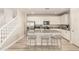Bright kitchen features granite counters, stainless appliances, and a large island with seating for three at 263 N Wilson Dr, Chandler, AZ 85225
