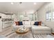 Spacious open-concept living room flowing seamlessly into kitchen and dining areas at 263 N Wilson Dr, Chandler, AZ 85225