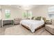 Well-lit main bedroom features a king bed, sofa, two large windows, and neutral décor at 263 N Wilson Dr, Chandler, AZ 85225