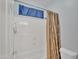 White tiled bathtub with brown shower curtain at 2642 S Joplin --, Mesa, AZ 85209