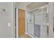 Modern bathroom showcasing a glass-enclosed shower and a built-in storage cabinet for added convenience at 2642 S Joplin --, Mesa, AZ 85209