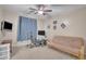 Comfortable bedroom with ceiling fan offering a versatile space for relaxation, study, or entertainment at 2642 S Joplin --, Mesa, AZ 85209