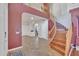 Spacious foyer featuring a curved staircase, tile floors, and neutral paint colors at 2642 S Joplin --, Mesa, AZ 85209