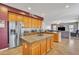 Spacious kitchen featuring stainless steel appliances, granite countertops, a center island, and ample cabinet space at 2642 S Joplin --, Mesa, AZ 85209