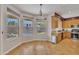 Bright kitchen area with tile floors, stainless steel appliances, a breakfast nook, and views of the pool at 2642 S Joplin --, Mesa, AZ 85209