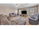 Comfortable living room featuring tile floors, a ceiling fan, and modern furniture for a relaxing atmosphere at 2642 S Joplin --, Mesa, AZ 85209