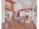 Open-concept living room showcasing high ceilings, a staircase, wood floors, and views into the dining room and second story at 2642 S Joplin --, Mesa, AZ 85209