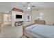 Cozy main bedroom offers carpeting, en-suite access, and modern entertainment setup for ultimate relaxation at 2642 S Joplin --, Mesa, AZ 85209