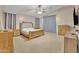 Bright main bedroom features neutral tones, carpet, and a large window for natural light and spacious feel at 2642 S Joplin --, Mesa, AZ 85209