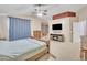 Spacious main bedroom features vaulted ceiling, fireplace, and carpet flooring to create a comfortable retreat at 2642 S Joplin --, Mesa, AZ 85209