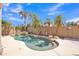 Sparkling pool with rock features, surrounded by lush landscaping and palm trees, perfect for outdoor enjoyment at 2642 S Joplin --, Mesa, AZ 85209
