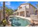 Relaxing backyard featuring a private pool, covered patio, balcony, spa, and lush greenery for the ultimate outdoor living at 2642 S Joplin --, Mesa, AZ 85209