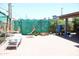 Spacious backyard features a brick patio area with covered shade structures for growing plants at 2718 W Montebello Ave, Phoenix, AZ 85017