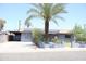 Street view of a single-story home with solar panels and a driveway leading to a carport at 2718 W Montebello Ave, Phoenix, AZ 85017